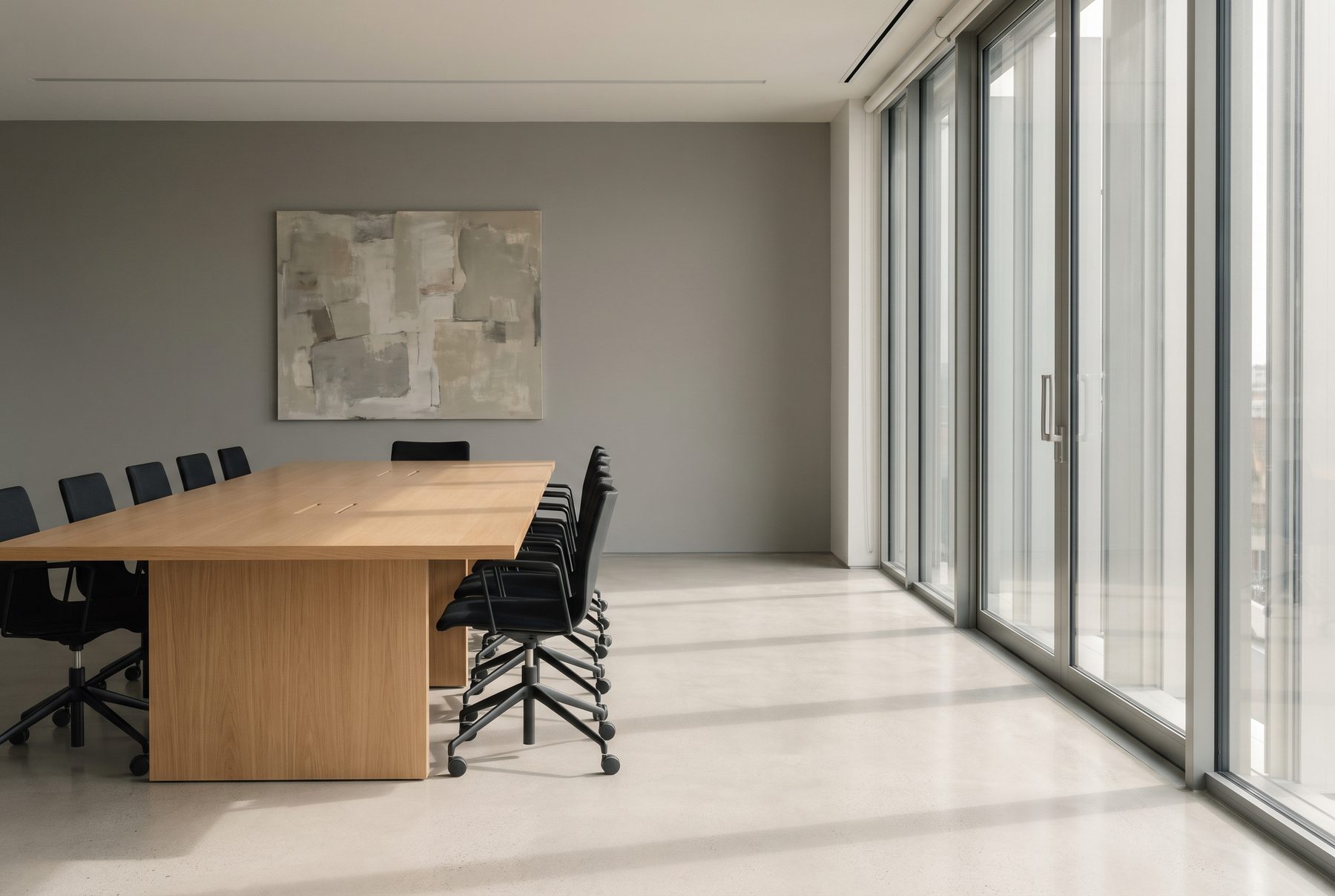 Interior of the GoDigi London office with a long shared working table and glass partitions
